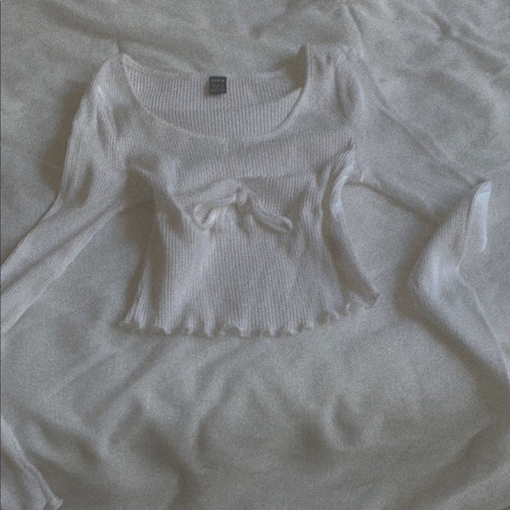 Simple white top with heart knot.